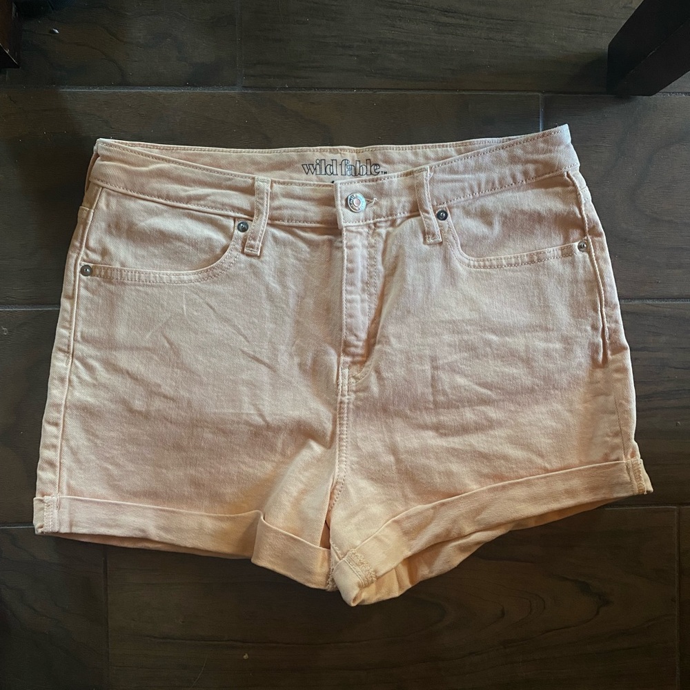 Super cute neon peach denim colored shorts.